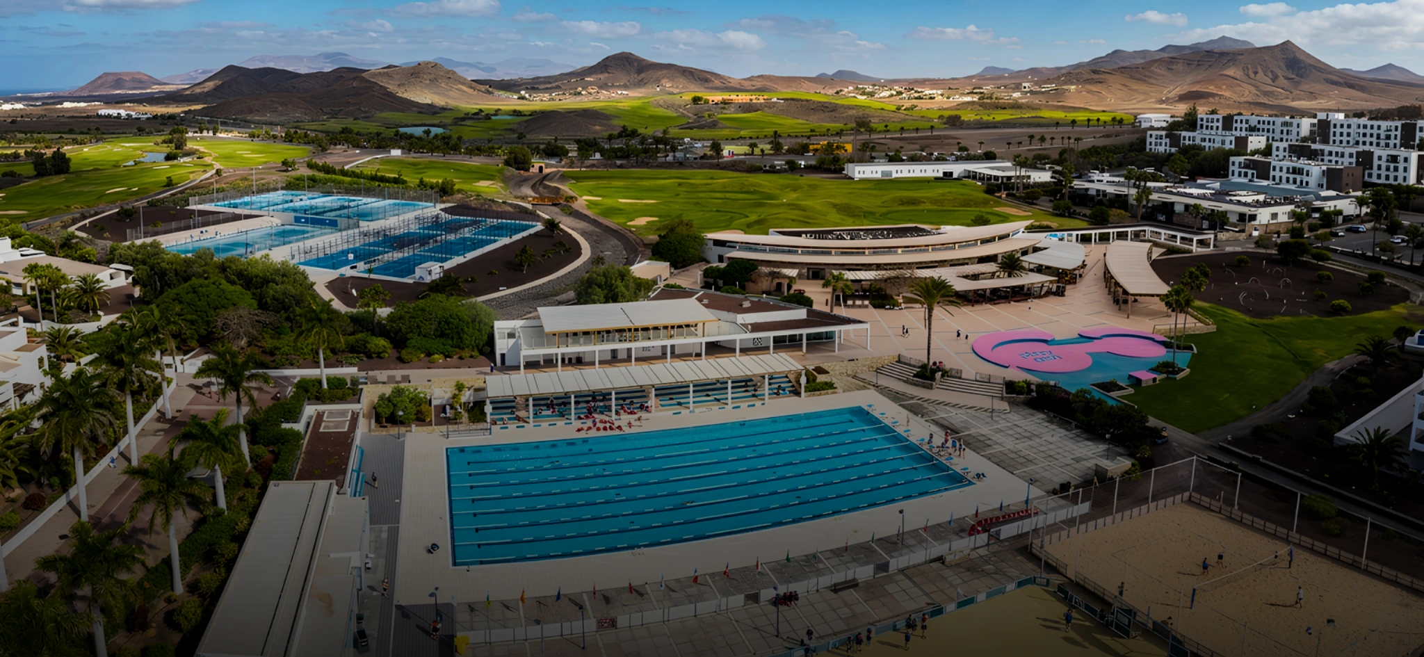 Aerial view of Playitas Resort in Fuerteventura showing outdoor 50m pools, training complex and volcanic hills